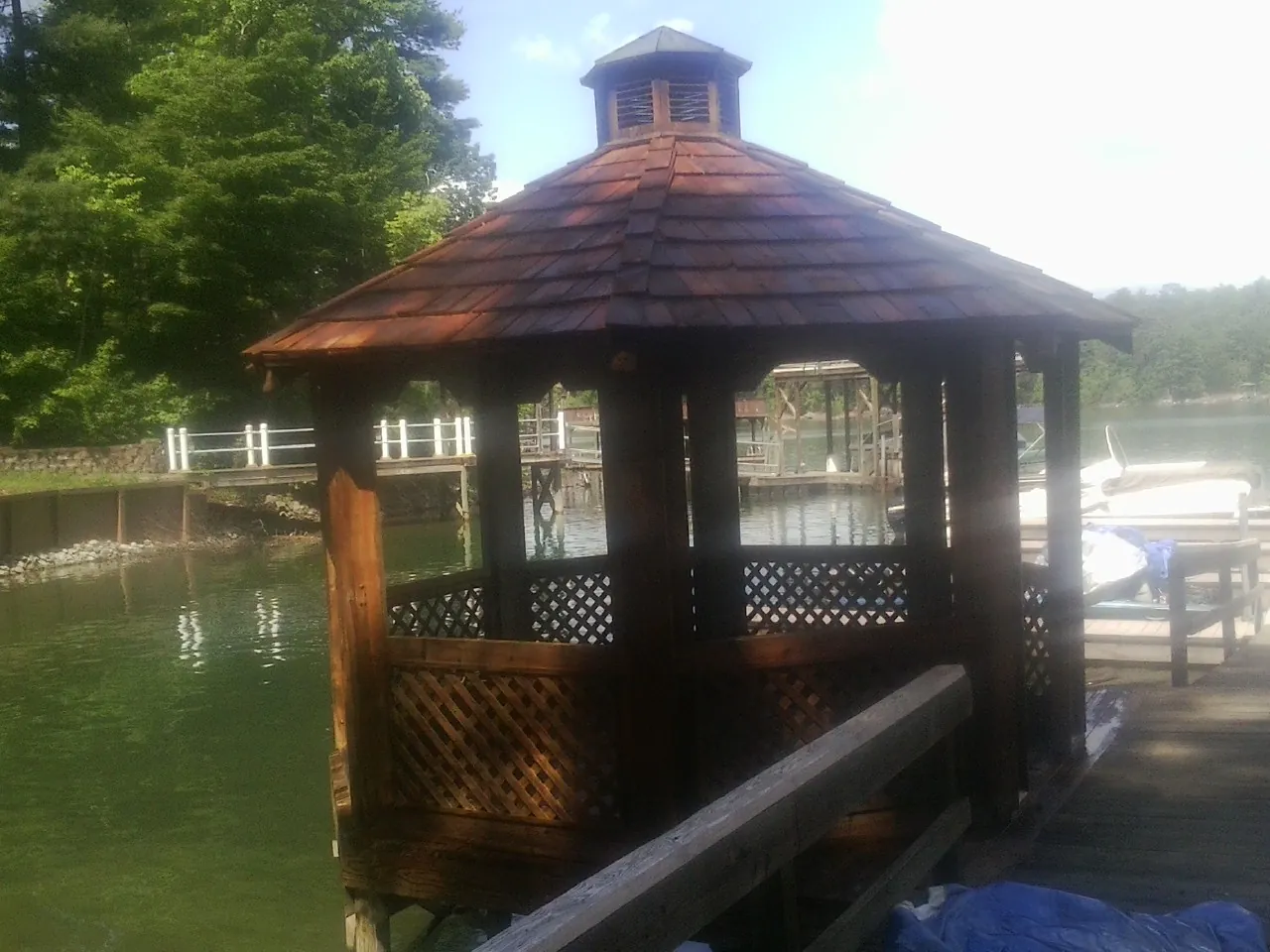 Cedar shake gazebo roof rebuilt on a lake dock in Lewiston